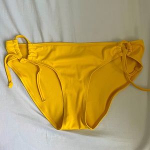Yellow bathing suit bottoms.